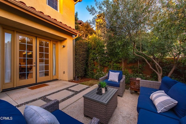 view of patio with an outdoor living space and french doors