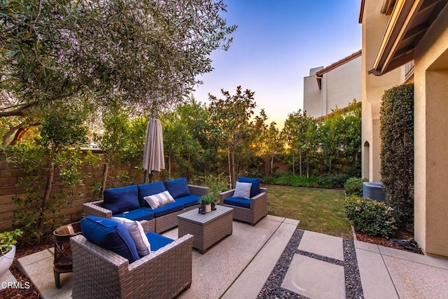 patio terrace at dusk with an outdoor living space