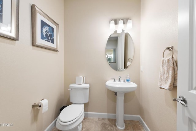 bathroom with tile patterned floors and toilet