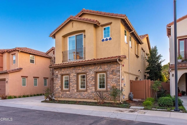 mediterranean / spanish-style home featuring a garage