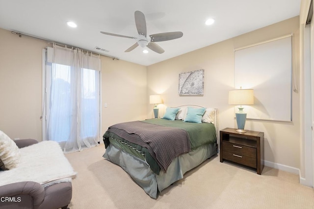 bedroom featuring light colored carpet and ceiling fan