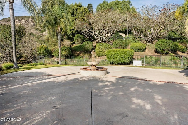 view of home's community with a patio area