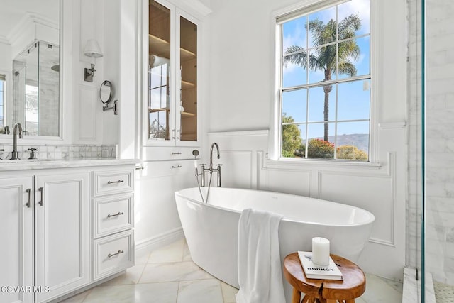 bathroom featuring vanity and plus walk in shower