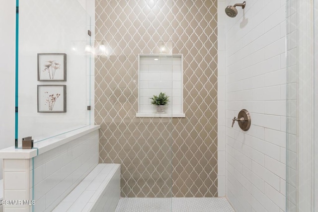 bathroom with a tile shower