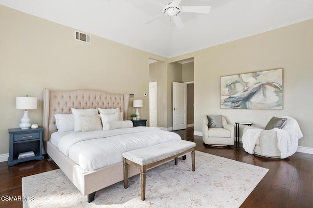 bedroom with dark hardwood / wood-style floors and ceiling fan