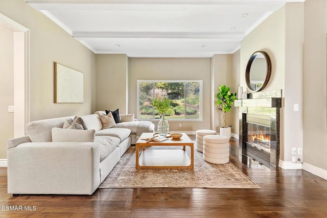 living room with ornamental molding, a high end fireplace, dark hardwood / wood-style floors, and beam ceiling