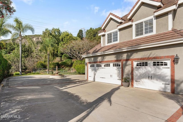 view of property exterior featuring a garage