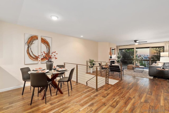 dining space featuring wood-type flooring