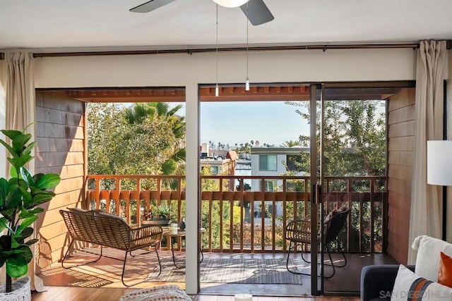 sunroom featuring ceiling fan and a healthy amount of sunlight