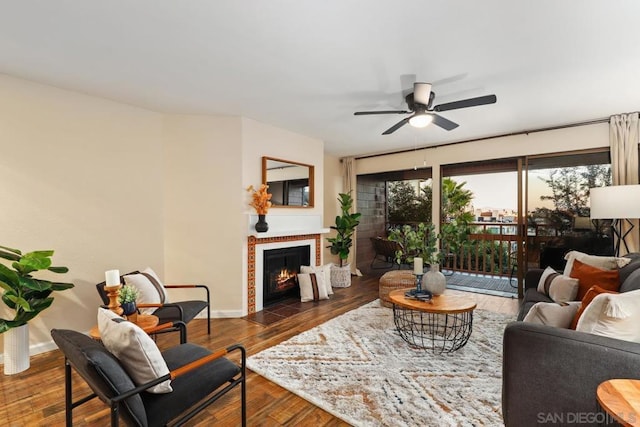 living room with dark wood-type flooring and ceiling fan