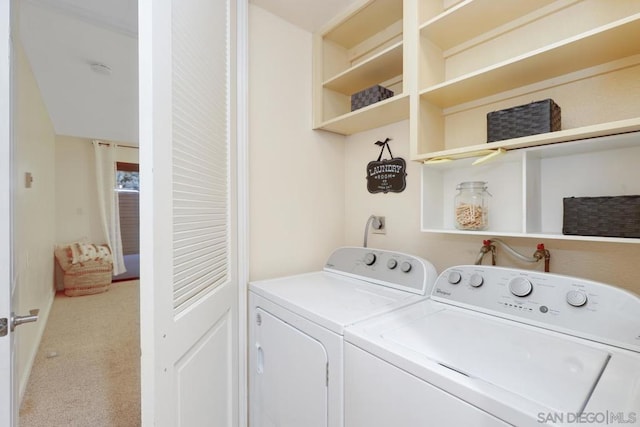 laundry room with carpet floors and washer and clothes dryer