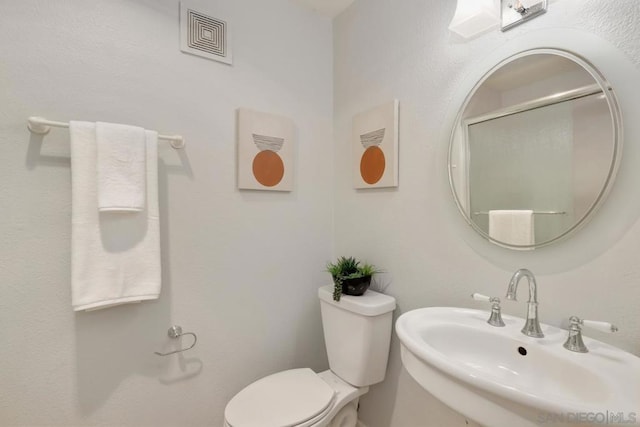 bathroom with sink and toilet