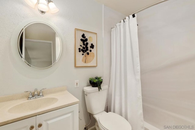 bathroom with vanity, toilet, and a shower with shower curtain