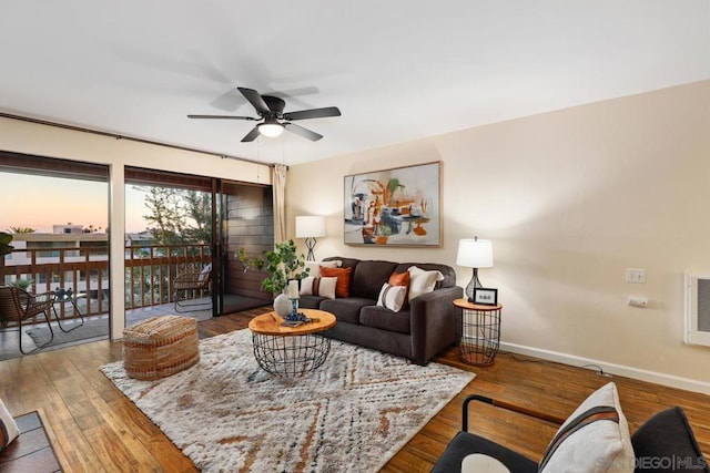 living room featuring hardwood / wood-style flooring and ceiling fan