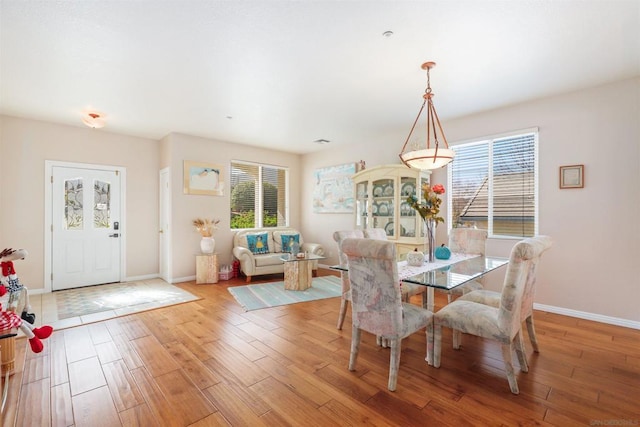 dining space with light hardwood / wood-style floors