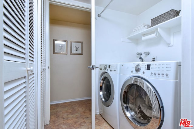 clothes washing area featuring washing machine and clothes dryer