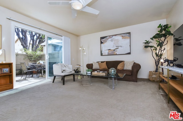 living room with carpet and ceiling fan