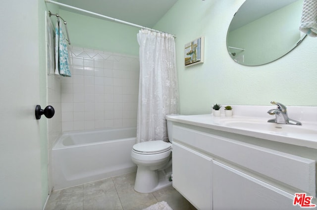 full bathroom with vanity, shower / bath combination with curtain, tile patterned floors, and toilet