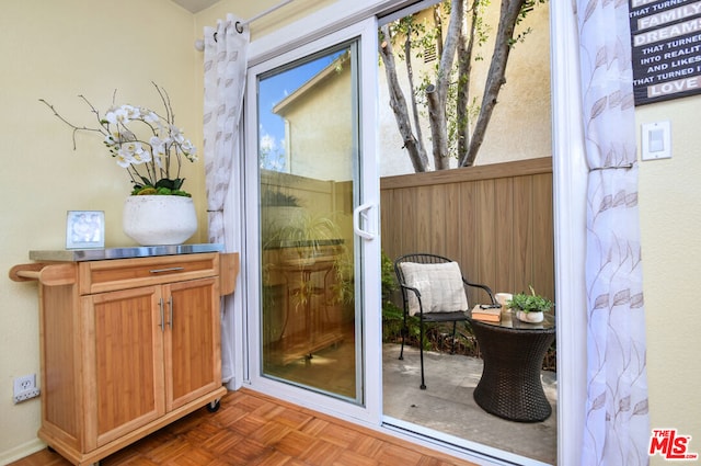 entryway featuring dark parquet floors