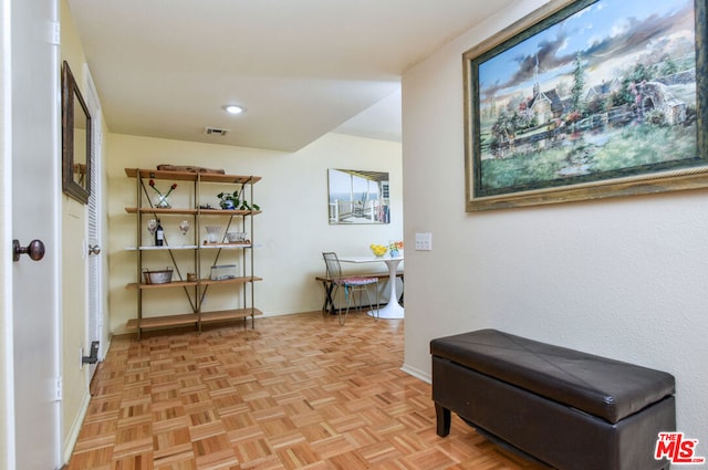 hallway featuring light parquet flooring