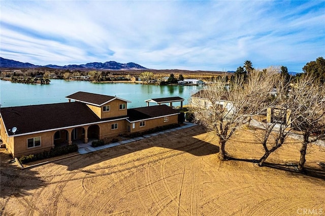 bird's eye view featuring a water and mountain view