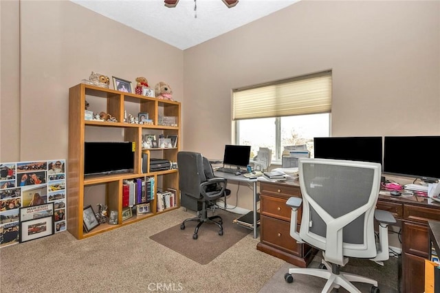 office with carpet floors and ceiling fan