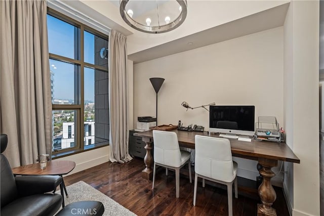 office featuring dark hardwood / wood-style floors and an inviting chandelier