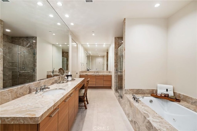 bathroom with vanity, independent shower and bath, and tile patterned flooring