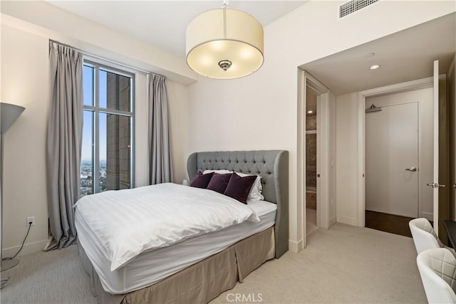 bedroom featuring light carpet