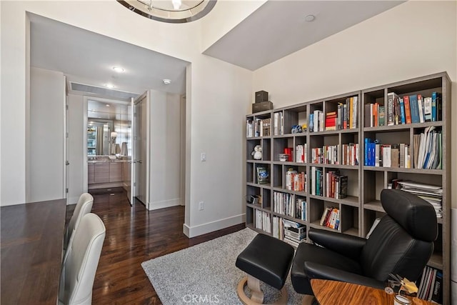 living area with dark hardwood / wood-style floors