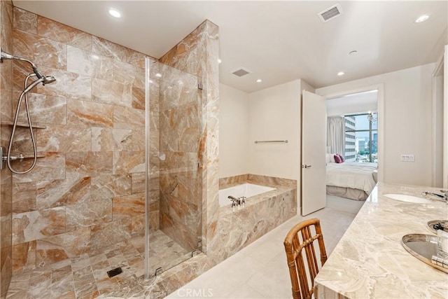 bathroom with sink and independent shower and bath