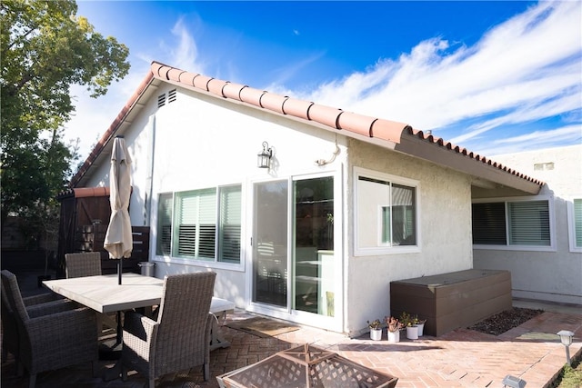 rear view of property with a patio