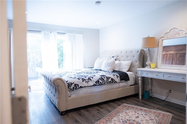 bedroom featuring dark wood-type flooring