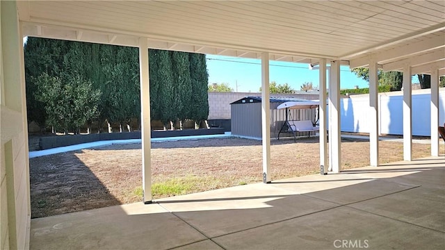 exterior space featuring concrete floors and a healthy amount of sunlight