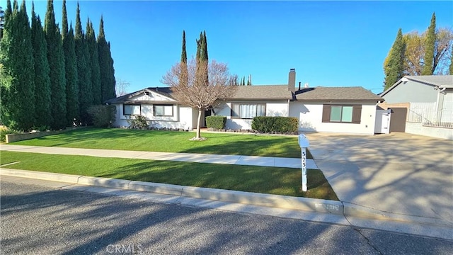 ranch-style home with a front yard