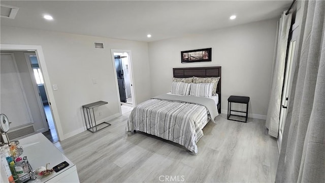 bedroom with light wood-type flooring