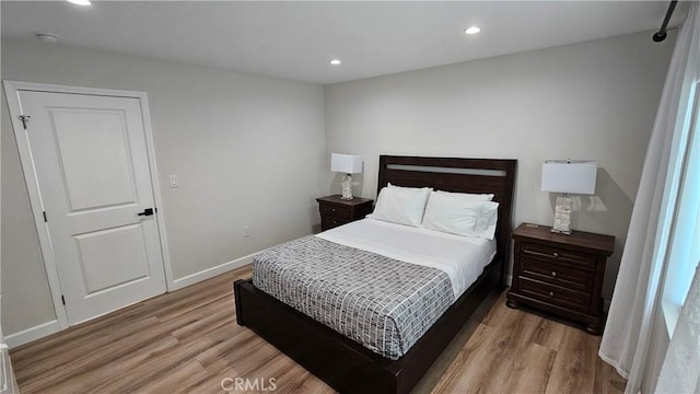 bedroom featuring light hardwood / wood-style flooring