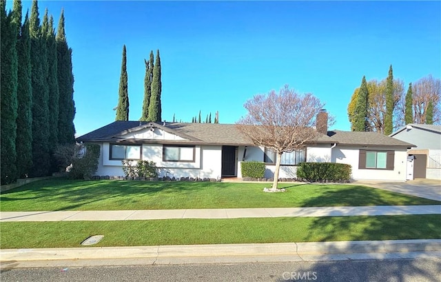 single story home with a front yard