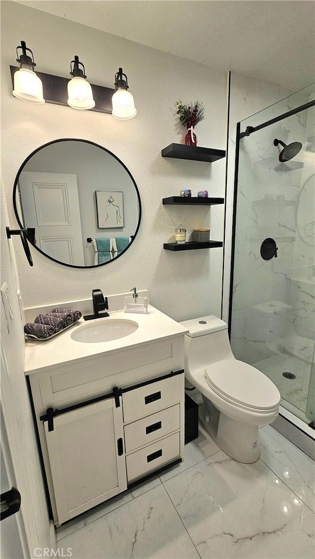 bathroom with an enclosed shower, vanity, and toilet