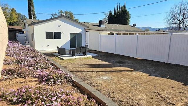 back of house featuring a patio