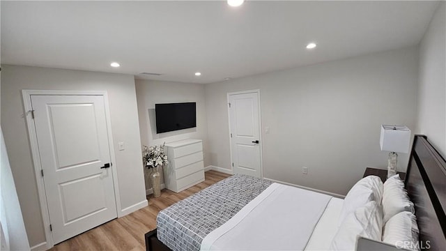 bedroom with light wood-type flooring