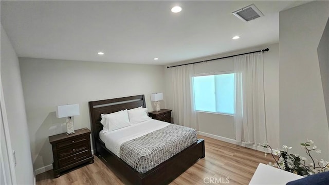 bedroom with light wood-type flooring