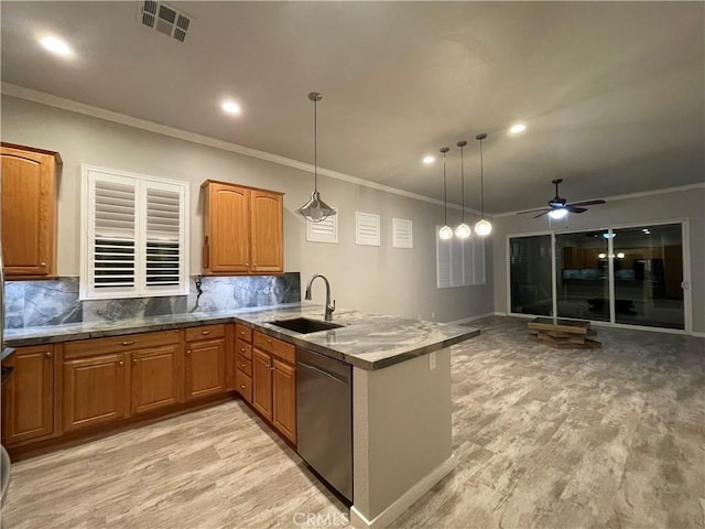 kitchen with pendant lighting, brown cabinets, a sink, dishwasher, and a peninsula