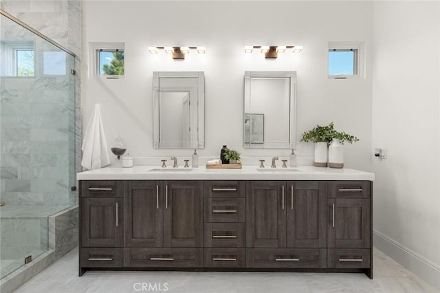 bathroom featuring vanity and a shower with door