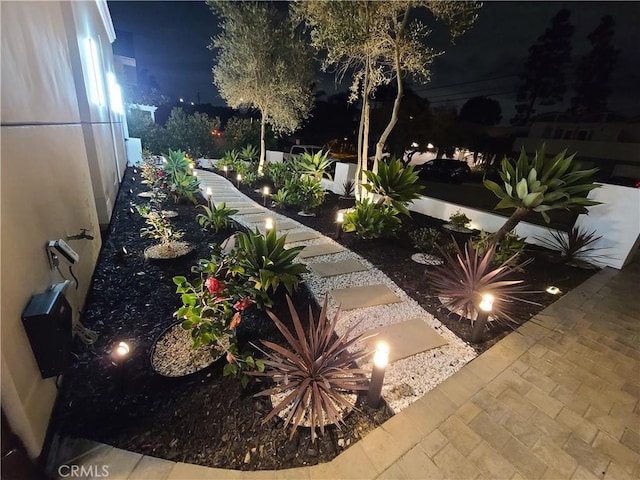 view of yard at twilight