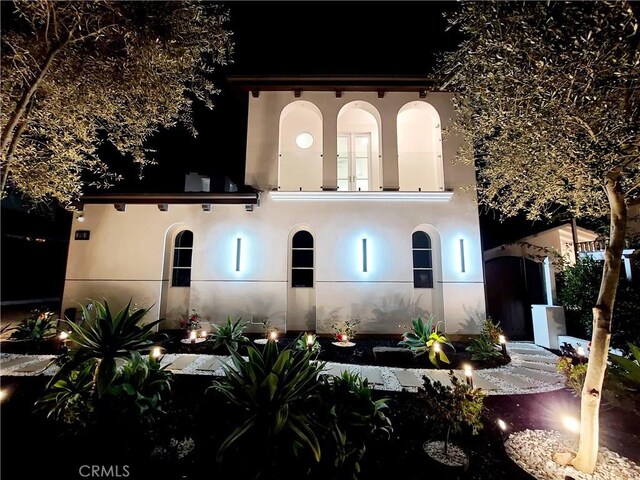 view of back house at night