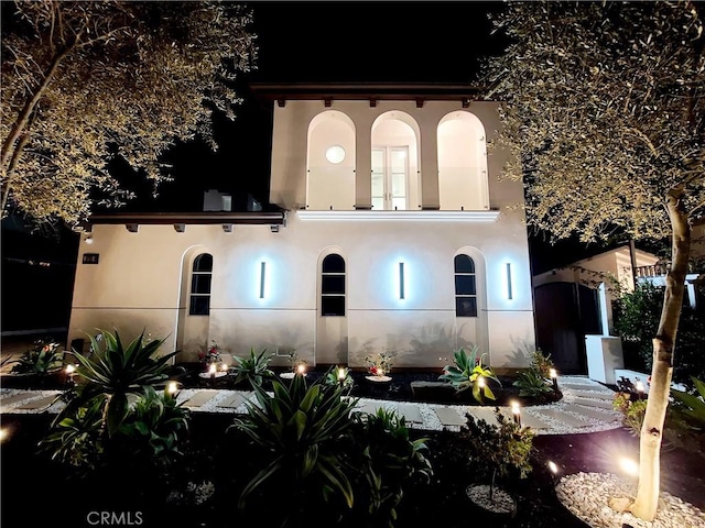 view of back house at night