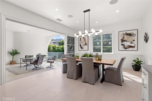 dining space with a notable chandelier