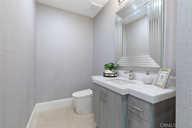 bathroom featuring tile patterned floors, vanity, and toilet