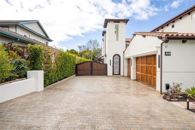 view of side of home featuring a garage